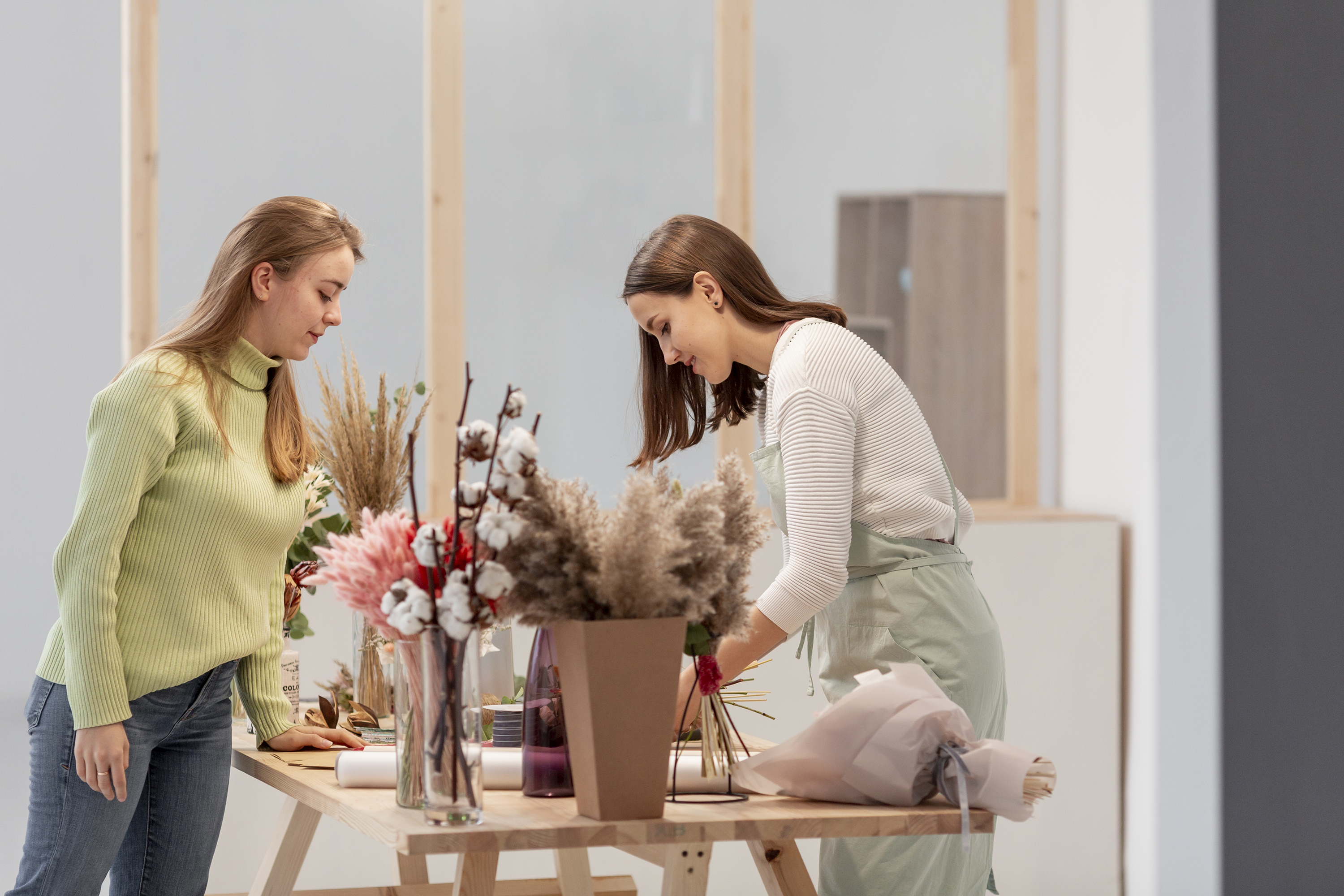 sideways-business-women-arranging-flower-shop